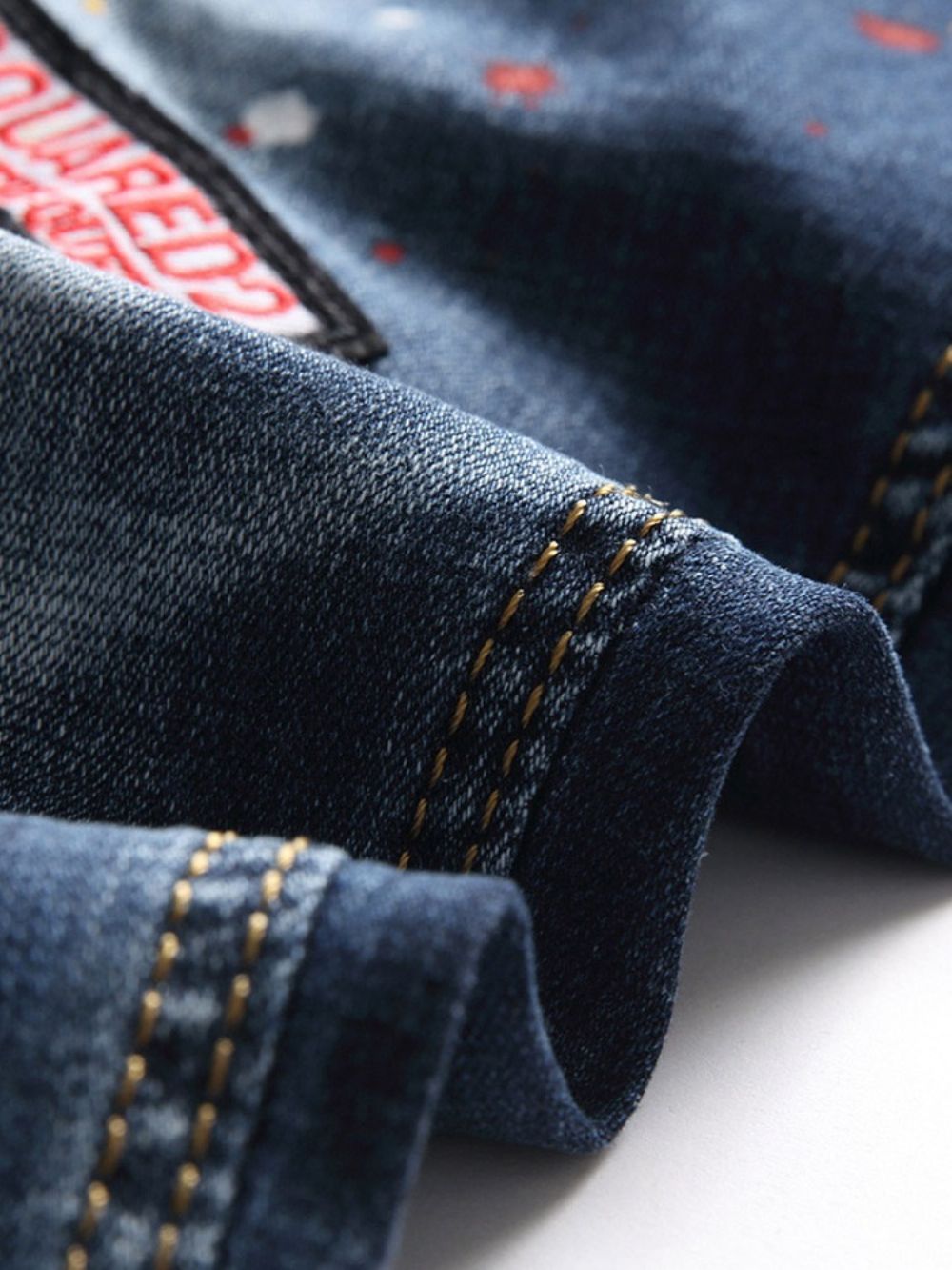 Jeans Met Kleurblokgat En Knoop Midden Taille